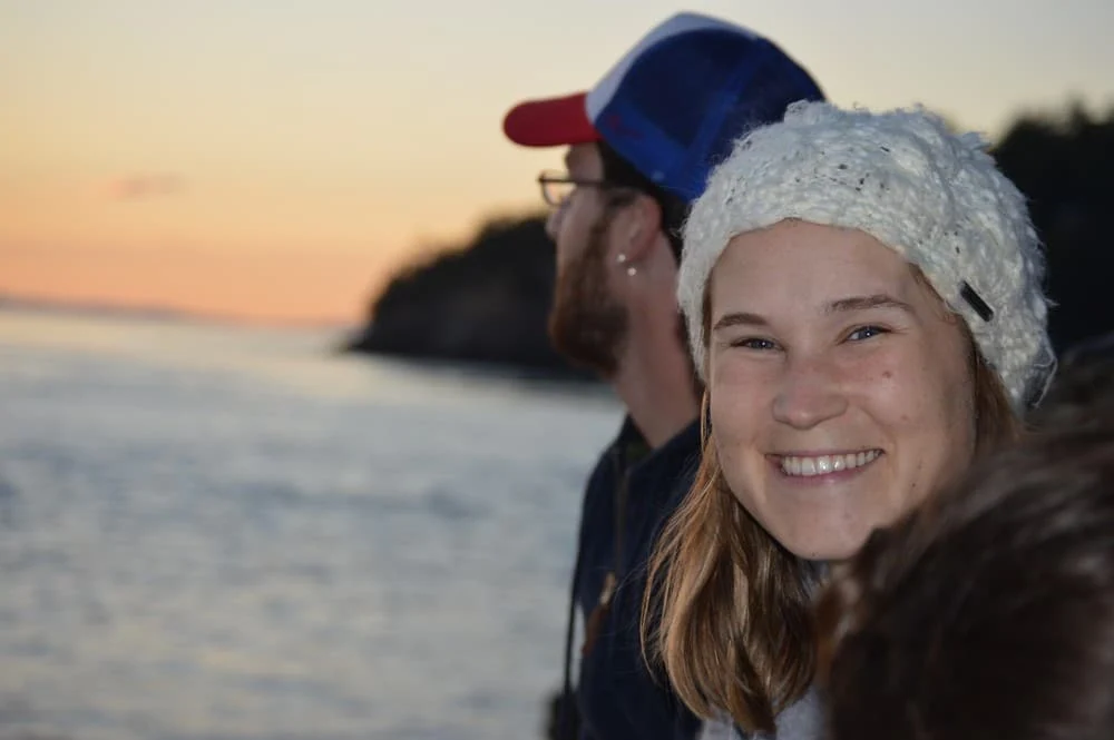 happy woman on a san juan islands kayaking expedition
